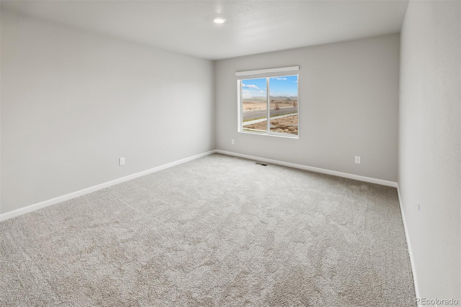 2175 Alyssa Street Fort Lupton, CO 80621 - Photo 8 of 39 an empty room with windows