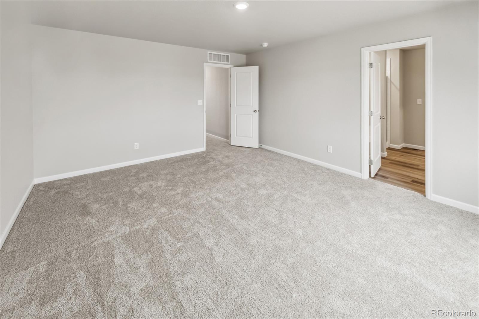 2175 Alyssa Street Fort Lupton, CO 80621 - Photo 9 of 39 a view of an empty room