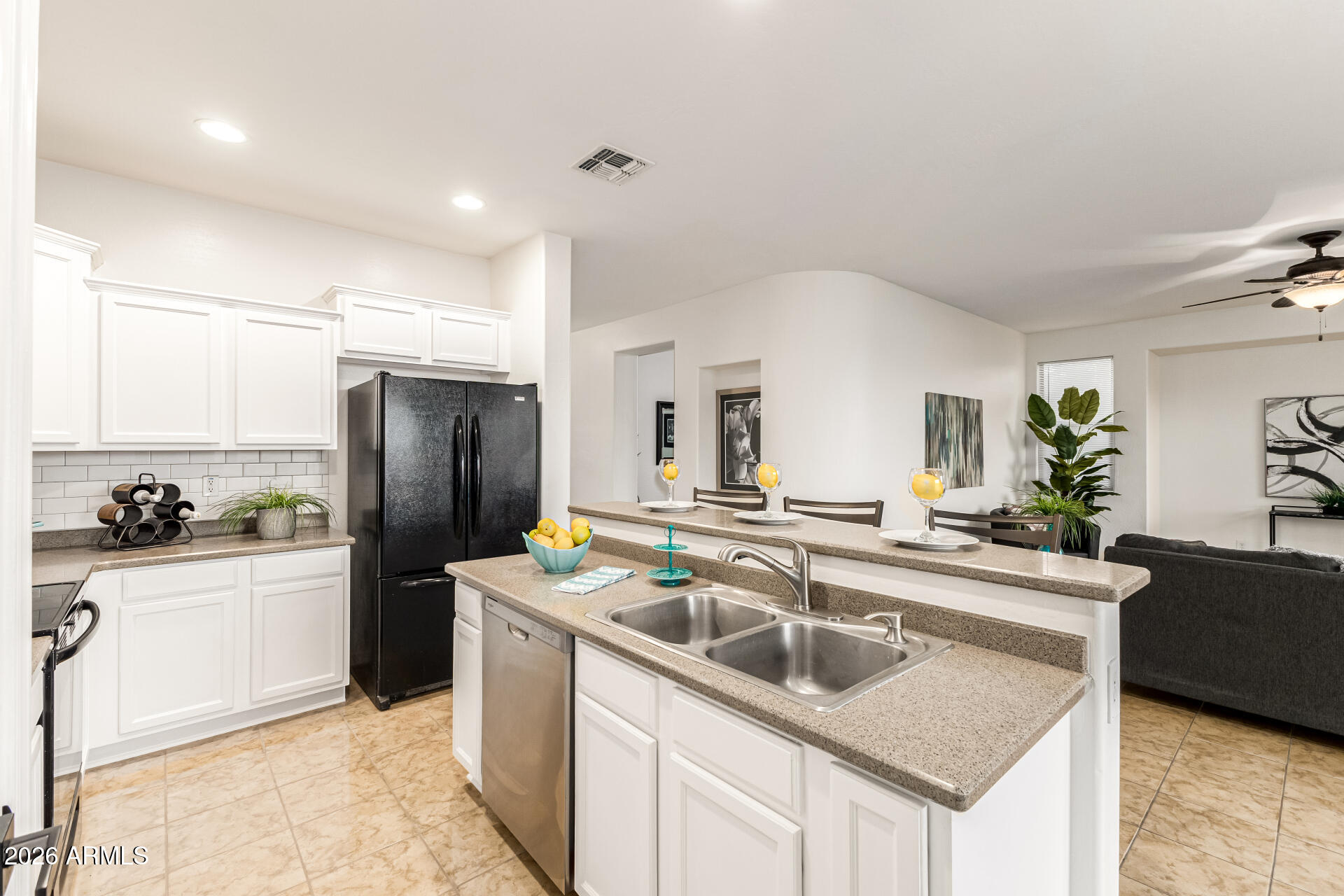 8205 South 23rd Place Phoenix, AZ 85042 - Photo 15 of 38 a kitchen with stainless steel appliances granite countertop a sink stove and refrigerator