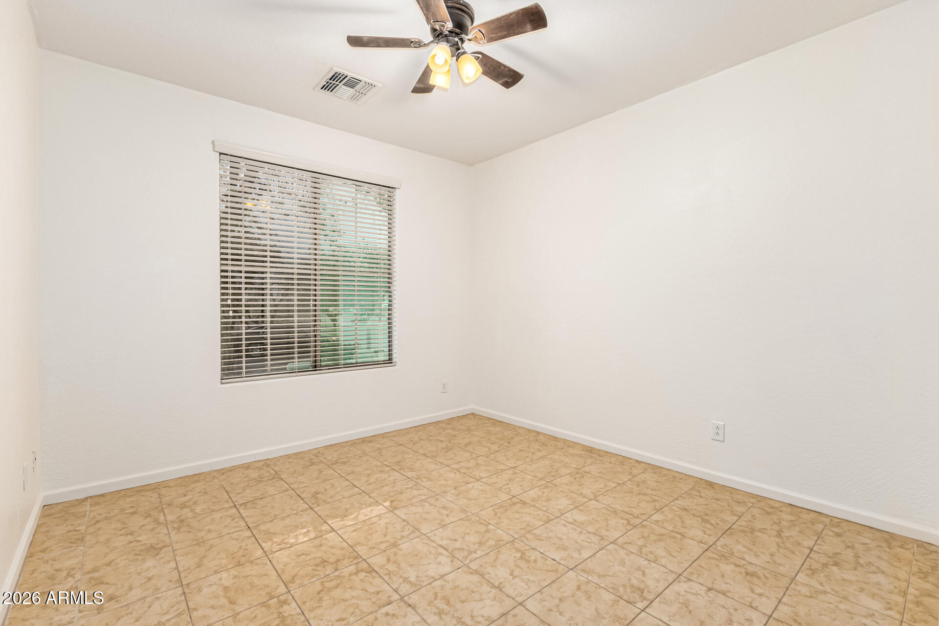 8205 South 23rd Place Phoenix, AZ 85042 - Photo 26 of 38 an empty room with a window and a fan