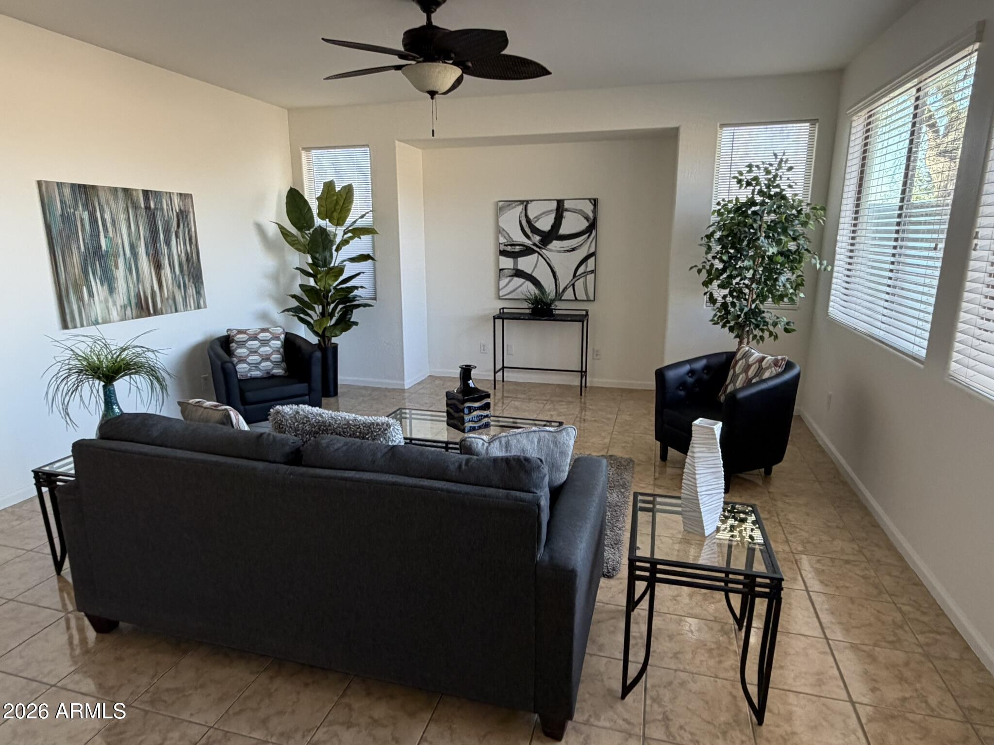 8205 South 23rd Place Phoenix, AZ 85042 - Photo 5 of 38 a living room with furniture and a potted plant
