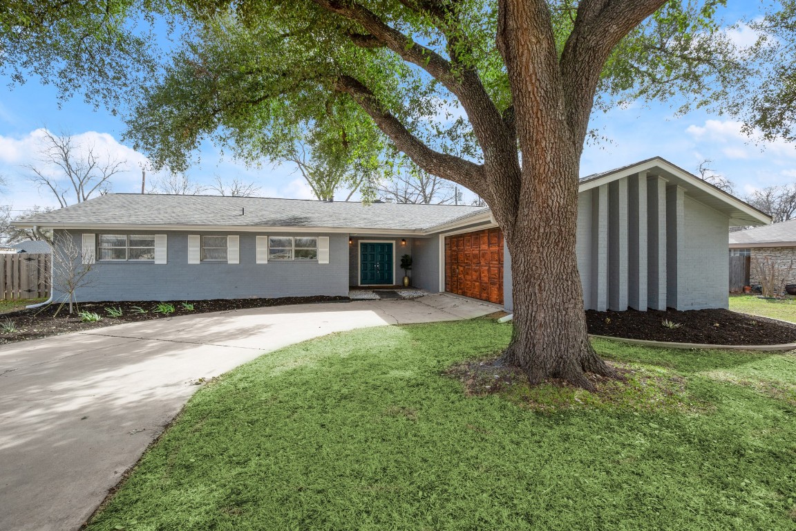 front view of a house with a yard