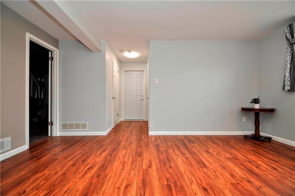 1313 Star Ridge Drive Pittsburgh, PA 15241 - Photo 32 of 36 a view of a room with wooden floor and a bench