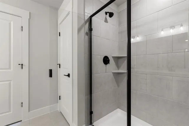 a bathroom with a glass shower door