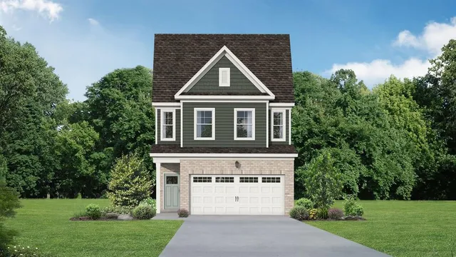 a white house with a yard and a small yard