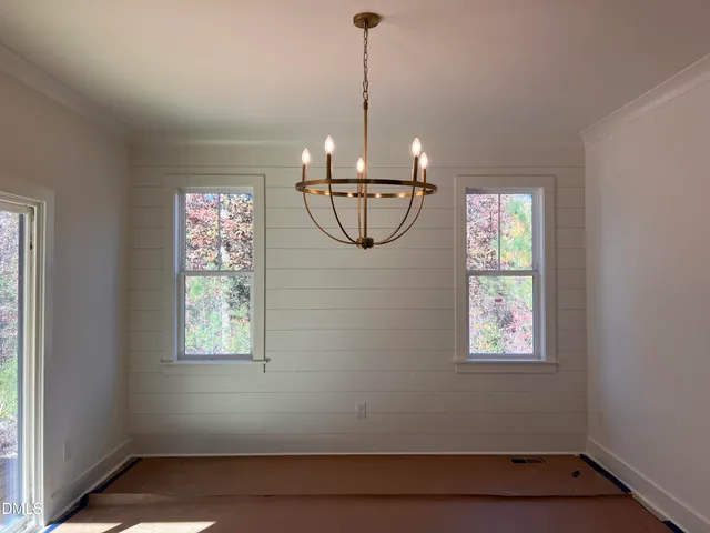 a view of entryway with window and chandelier