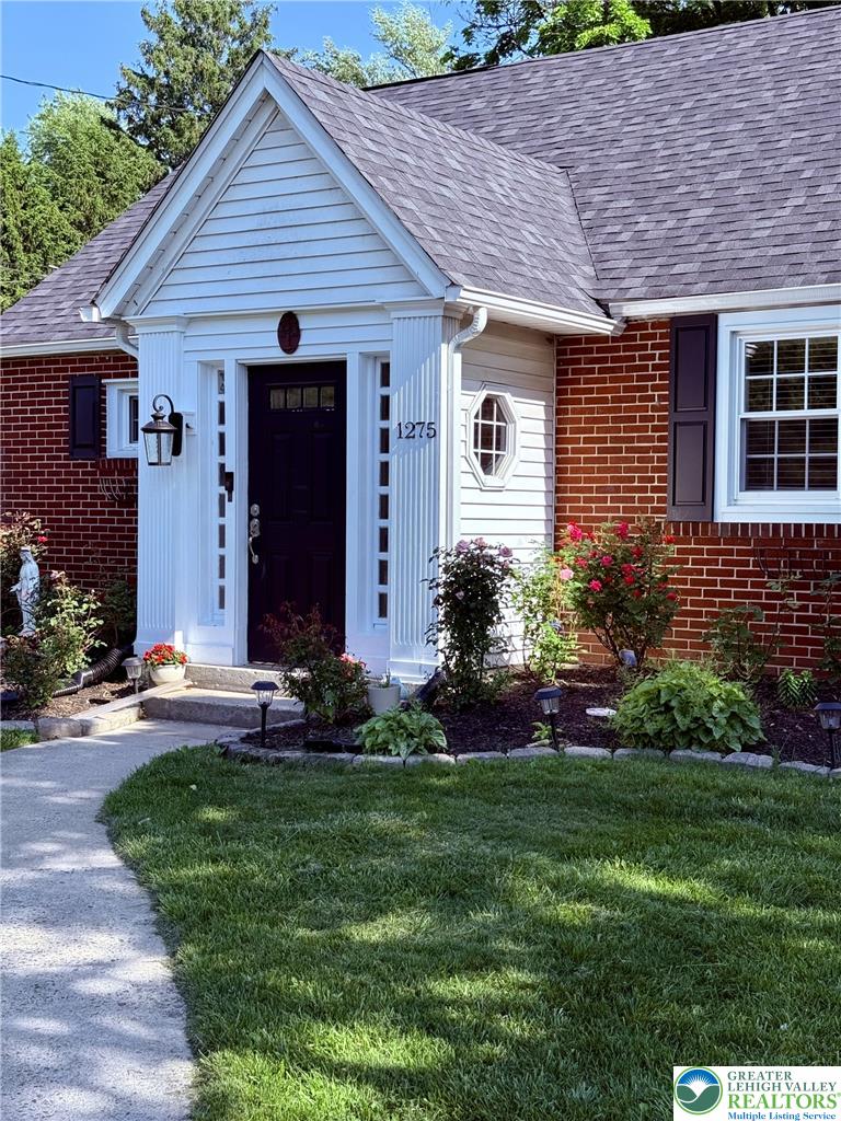 1275 Macada Road Bethlehem, PA 18017 - Photo 12 of 87 a front view of a house with a garden and plants