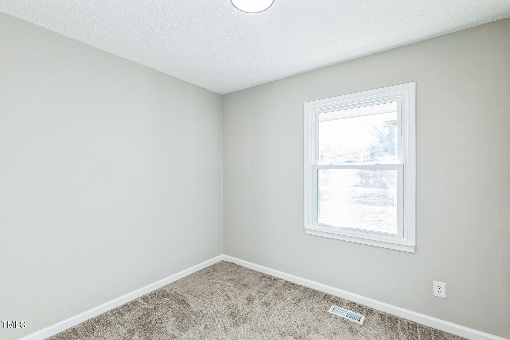1610 Fairground Road Dunn, NC 28334 - Photo 17 of 32 an empty room with a window