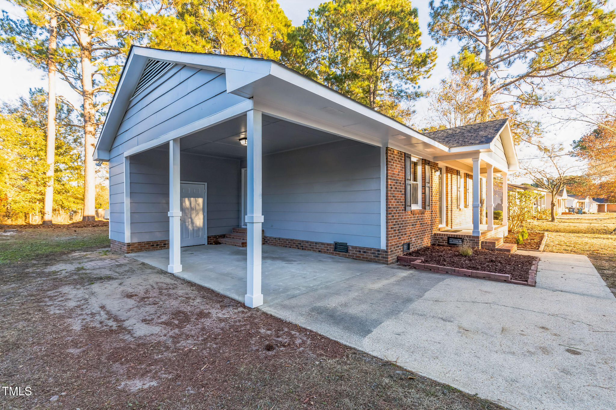 1610 Fairground Road Dunn, NC 28334 - Photo 29 of 32 a view of a house with a patio