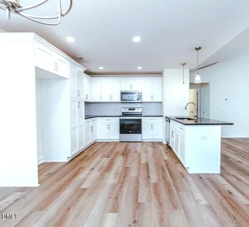 a view of kitchen with wooden floor