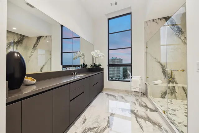 a large bathroom with a double vanity sink and a mirror
