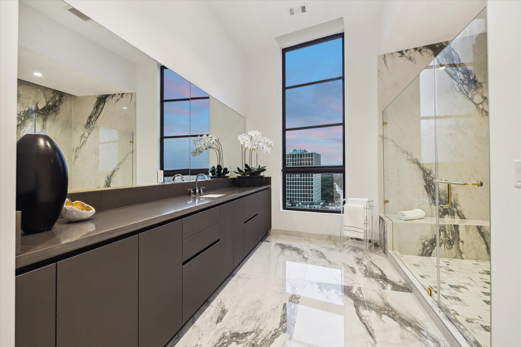 2323 San Felipe Street, Unit 1101 Houston, TX 77019 - Photo 11 of 25 a large bathroom with a double vanity sink and a mirror