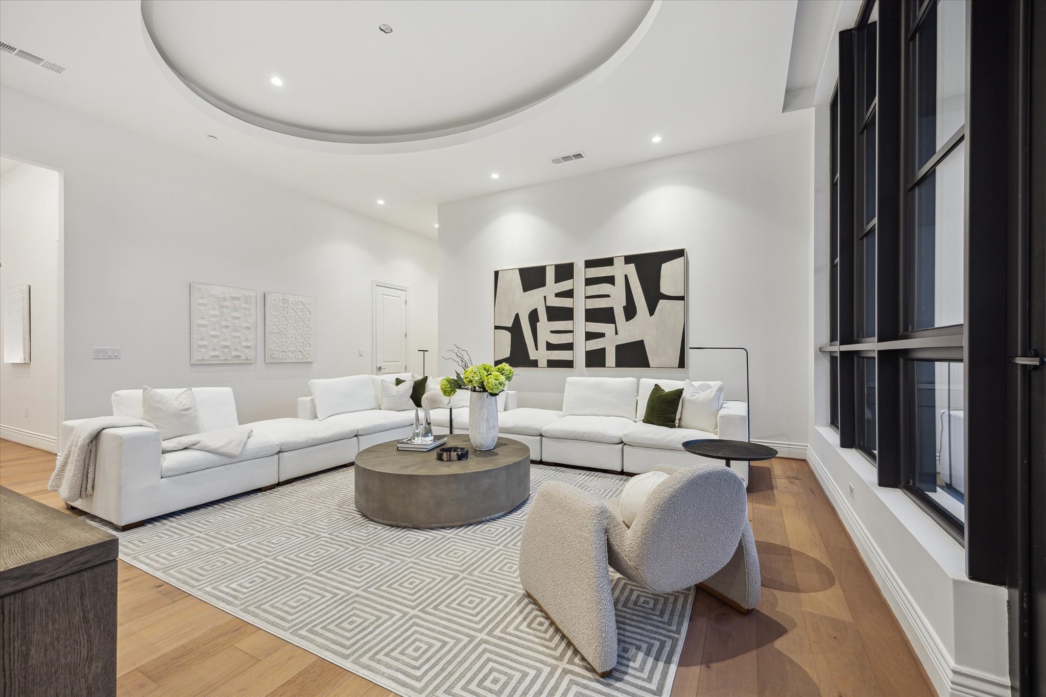 2323 San Felipe Street, Unit 1101 Houston, TX 77019 - Photo 2 of 25 a living room with furniture kitchen and a table