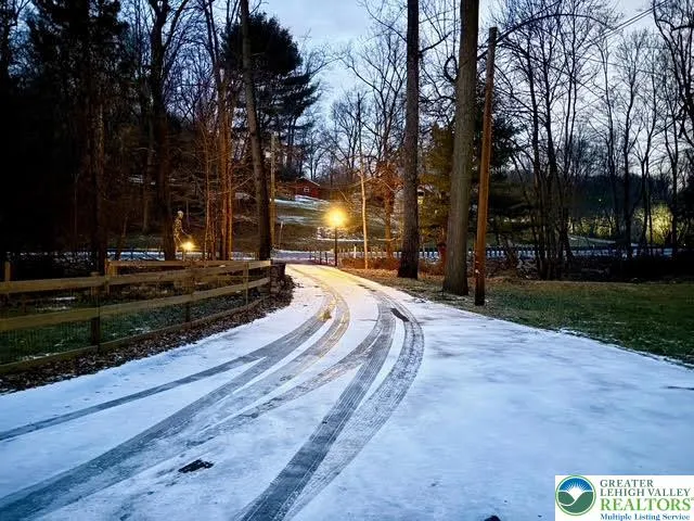 a swimming pool with outdoor seating and yard