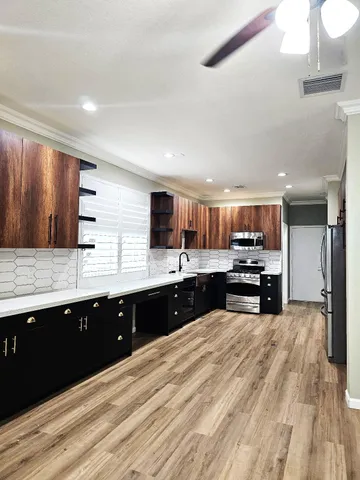 a kitchen with a sink and cabinets