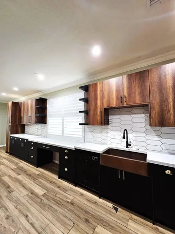 a bathroom with a sink a vanity and a mirror