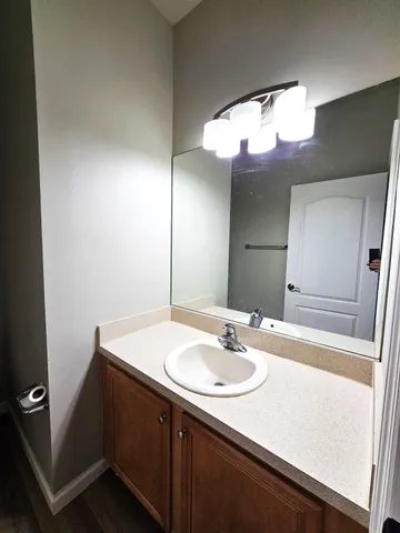 a view of staircase with lots of frames on wall