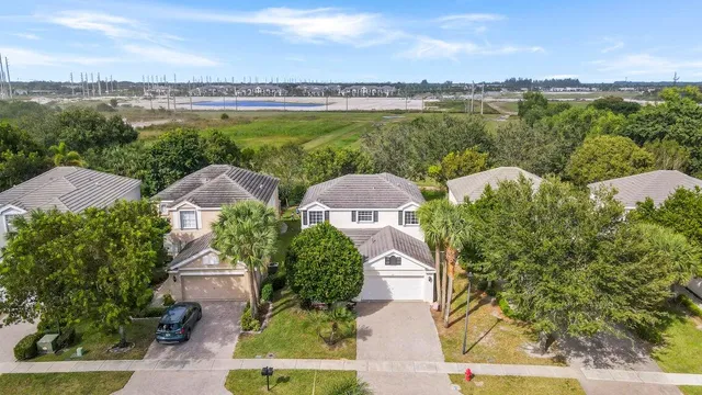 a view of a lake with houses in the back
