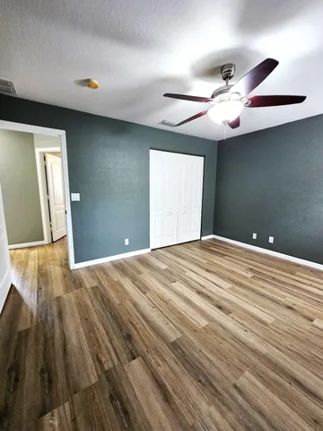 a view of a livingroom with wooden floor