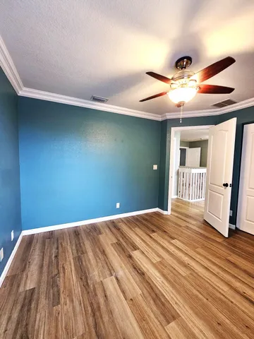 a bathroom with a bathtub shower sink vanity mirror and toilet