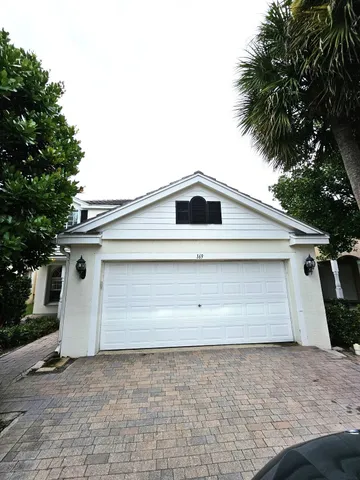a front view of house with garage