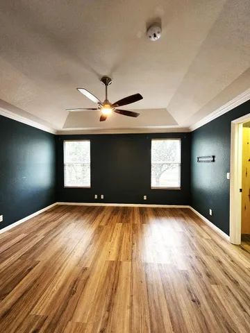 a bathroom with a tub sink shower and mirror