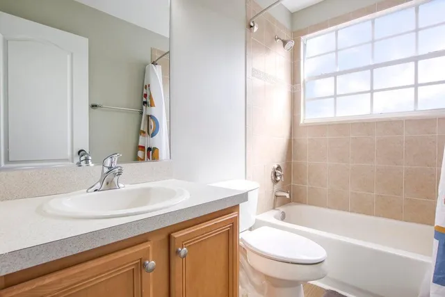 a room with a sink a vanity and mirror
