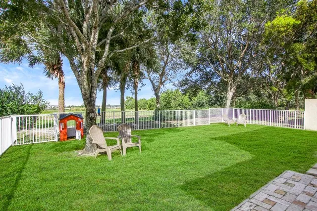 a backyard of a house with lots of green space