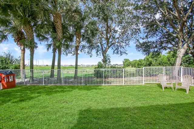 a view of a trees in front of a house