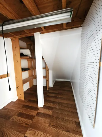 a kitchen with stainless steel appliances kitchen island granite countertop a sink counter space and cabinets