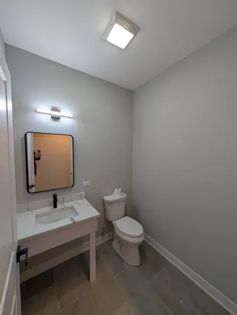 an empty room with a fireplace and window