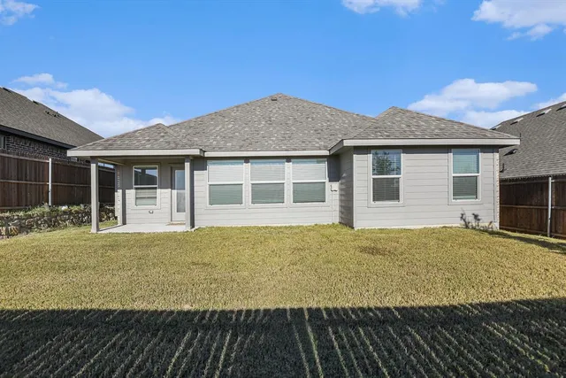 a house with trees in the background