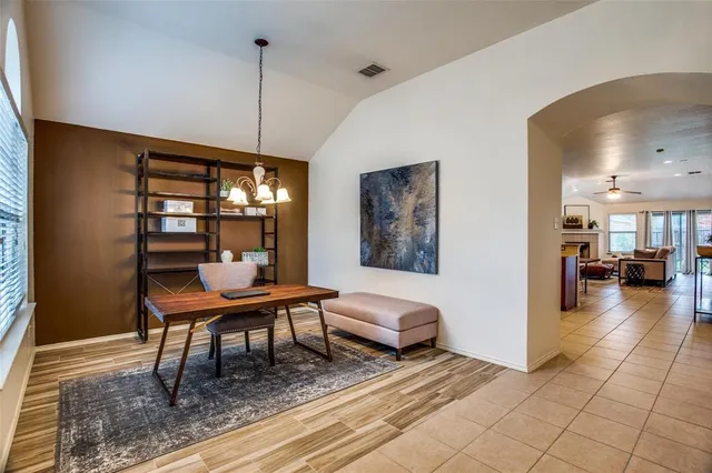 a bedroom with furniture and a chandelier