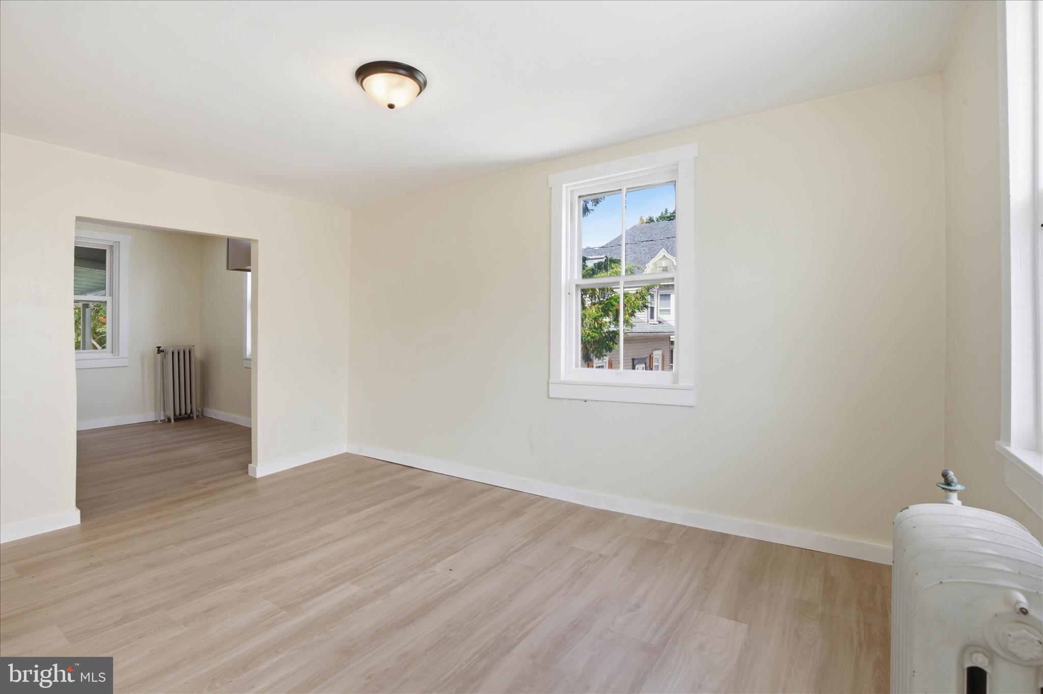 101 East Lincoln Avenue Lititz, PA 17543 - Photo 29 of 39 a view of an empty room with wooden floor and a window