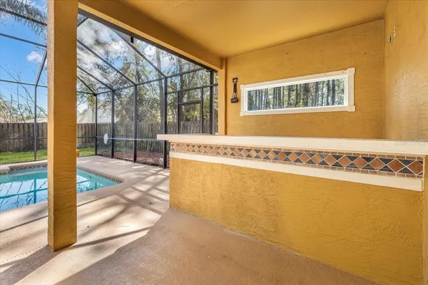 a kitchen with stainless steel appliances granite countertop a sink a counter space cabinets and a window