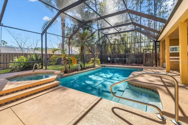 a kitchen with granite countertop a stove top oven microwave and cabinets