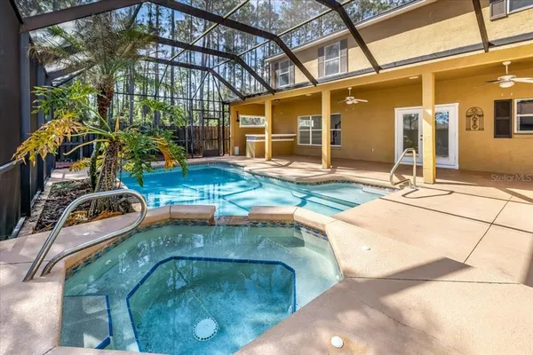 a backyard of a house with yard and outdoor seating