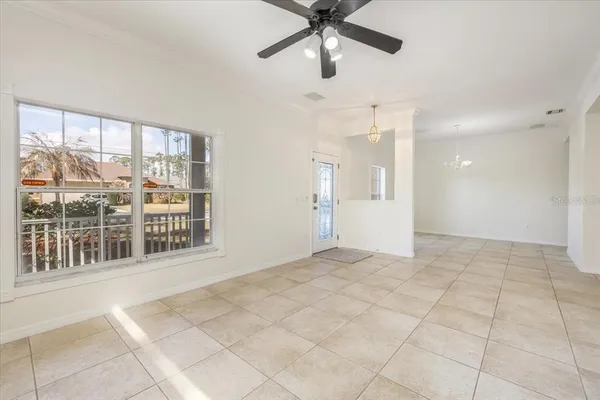 a spacious bathroom with a toilet sink and mirror