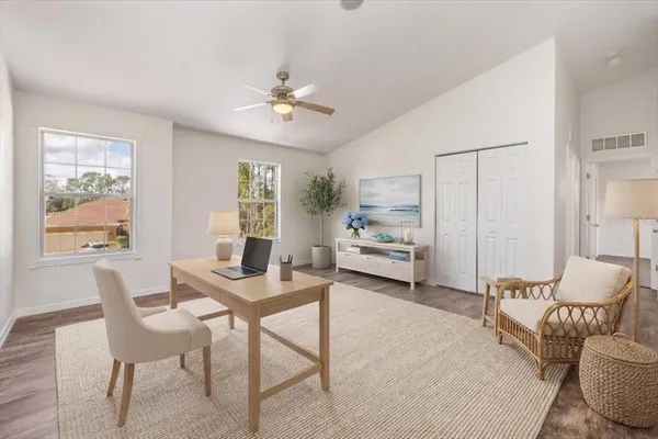 a view of walk in closet with empty racks