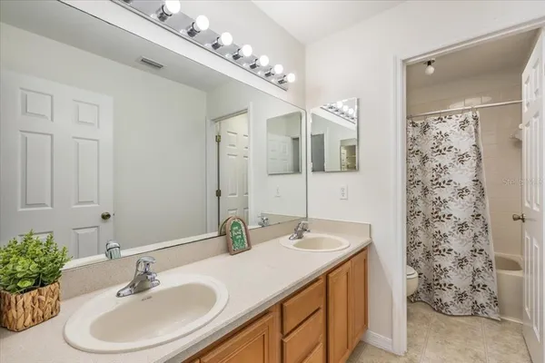 a view of a bathroom with a glass door shower