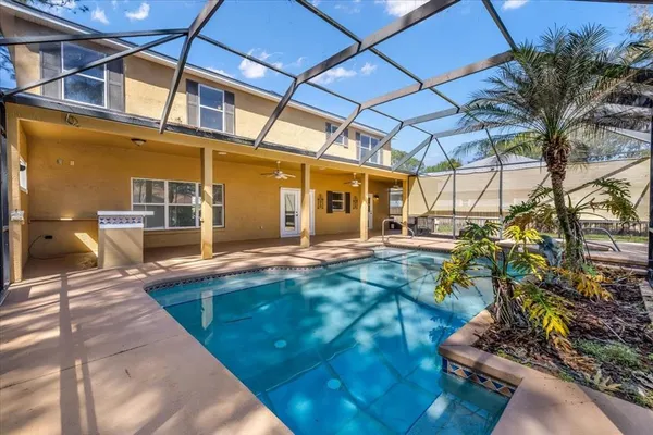 a backyard of a house with yard and outdoor seating