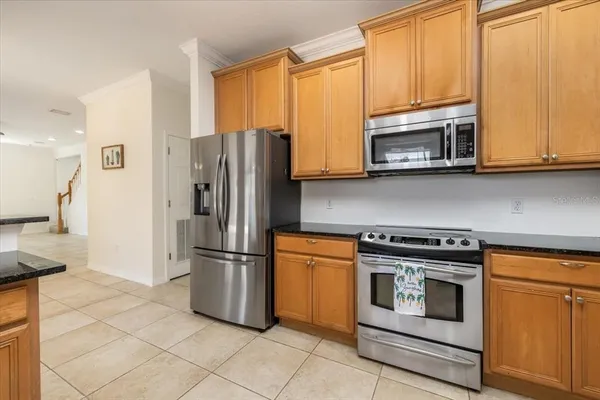 a view of a kitchen with furniture and a chandelier