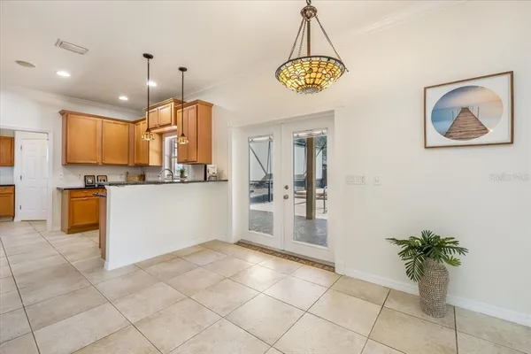 a bedroom with a bed table and a window