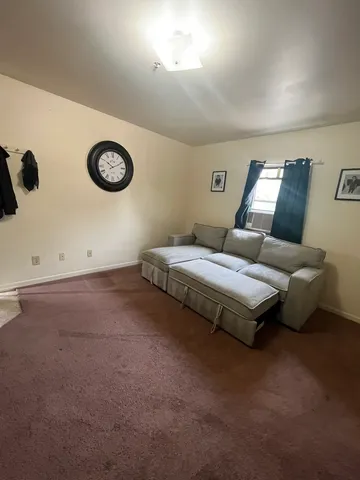 a bedroom with a bed and a table