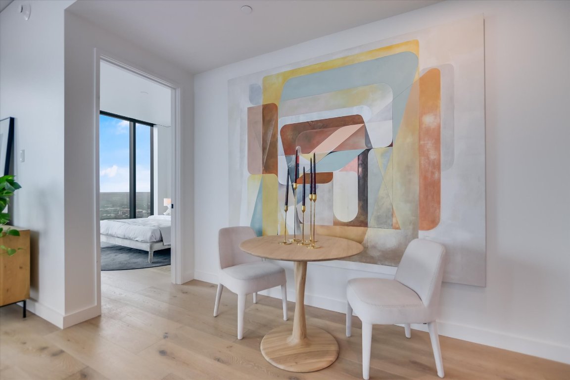 610 Davis Street, Unit 3002 Austin, TX 78701 - Photo 9 of 31 a dining room with furniture and window