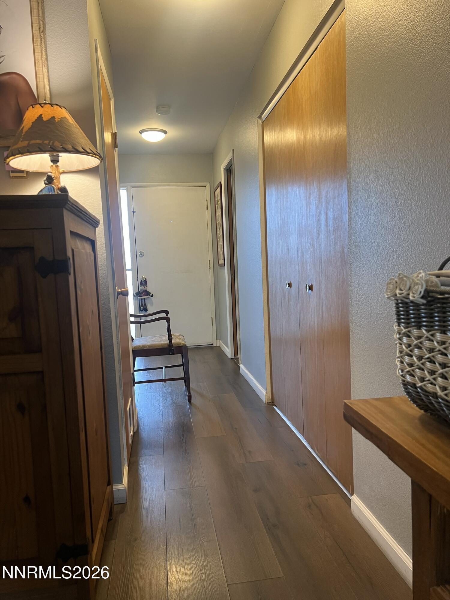 285 Smithridge Park Reno, NV 89502 - Photo 4 of 4 a view of a hallway with wooden floor