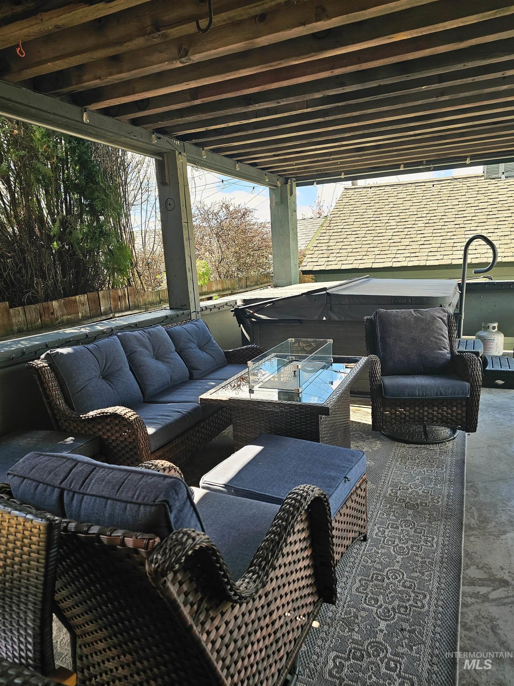 712 3rd Street Lewiston, ID 83501 - Photo 30 of 30 View of patio / terrace with an outdoor living space with a fire pit and hot tub