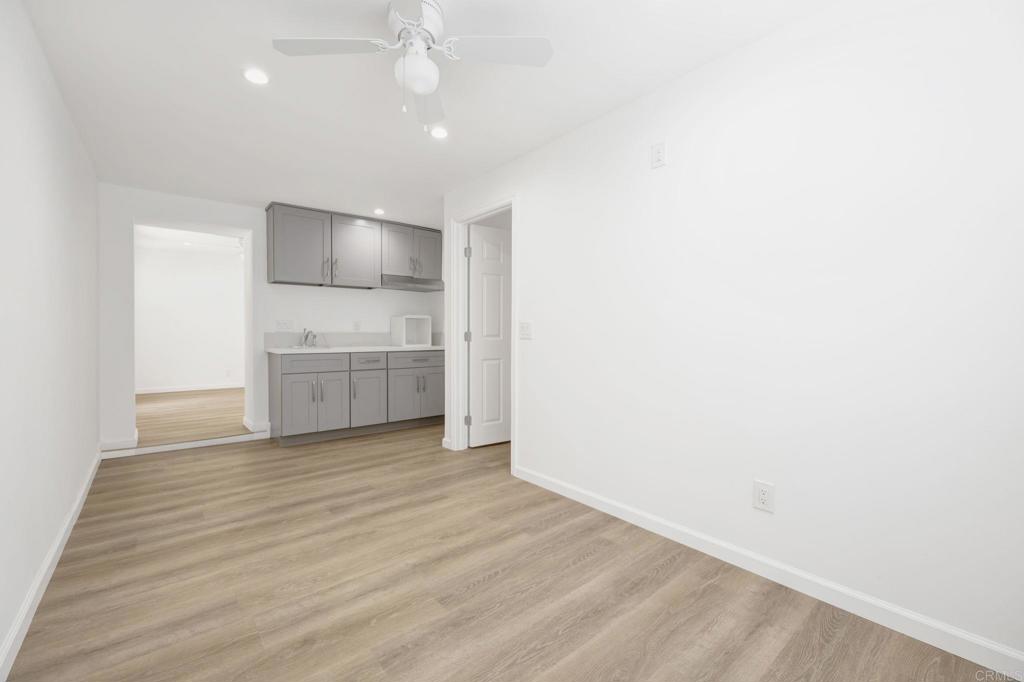 536 Hampton Road Burbank, CA 91504 - Photo 30 of 42 a view of kitchen and empty room with wooden floor