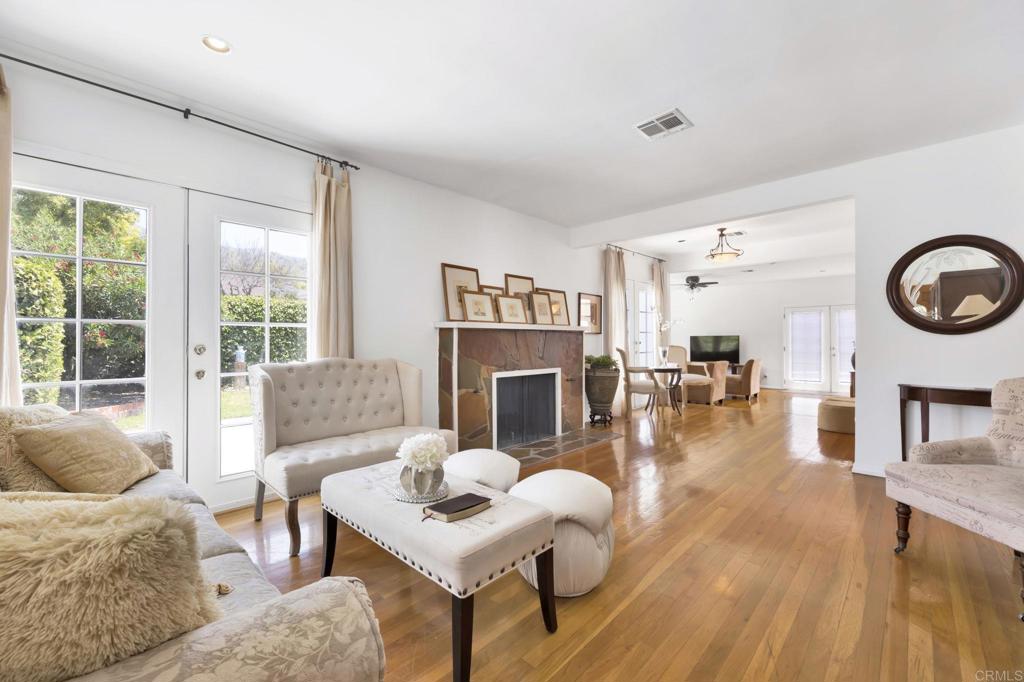 536 Hampton Road Burbank, CA 91504 - Photo 3 of 42 a living room with fireplace furniture and a large window