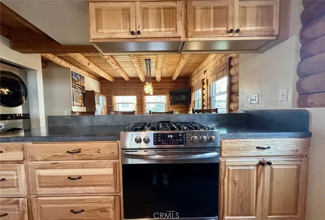 a kitchen with a stove and a microwave